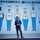 Yusaku Maezawa, the chief executive of Zozo, which operates Japan's popular fashion shopping site Zozotown and is officially called Start Today Co, speaks in front of a projection about Zozosuit at an event launching the debut of its formal apparel items, in Tokyo, Japan, July 3, 2018. Picture taken July 3, 2018. REUTERS/Kim Kyung-Hoon - RC1578C27420